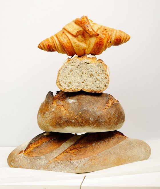 Icon Brötchen, Brote und Croissant übereinander gestapelt